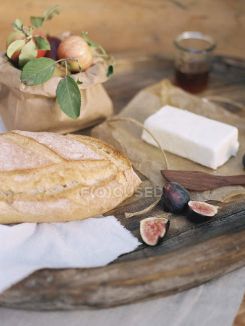 Table with food in Apple orchard — Stock Photo