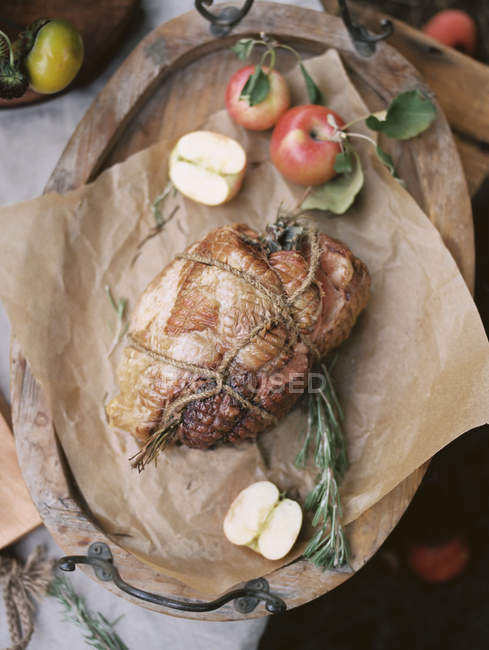 Food on a table, a roast and apples. — Stock Photo