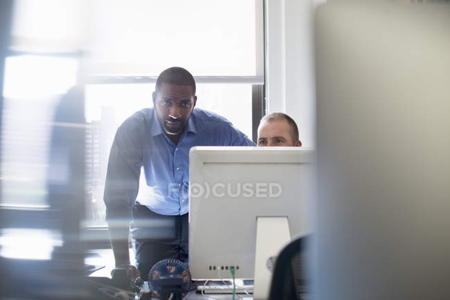 Two men working in an office — Stock Photo