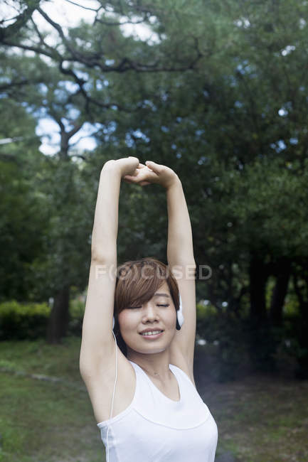 Woman stretching before exercise — Stock Photo