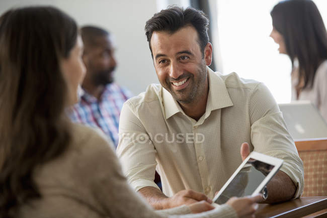 Four people in an office — Stock Photo