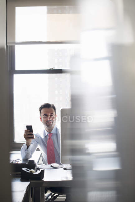 Man working at an office computer — Stock Photo
