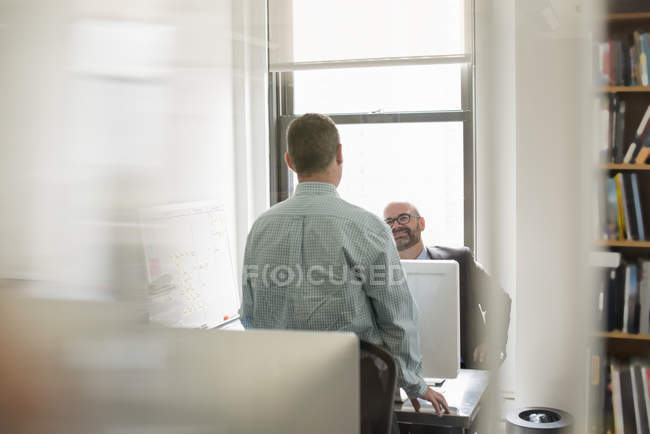 Businessmen talking to each other — Stock Photo