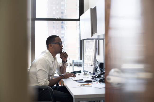 Man working in an office — Stock Photo