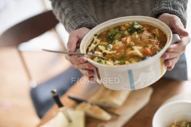 Man holding bowl with vegetable stew — Stock Photo