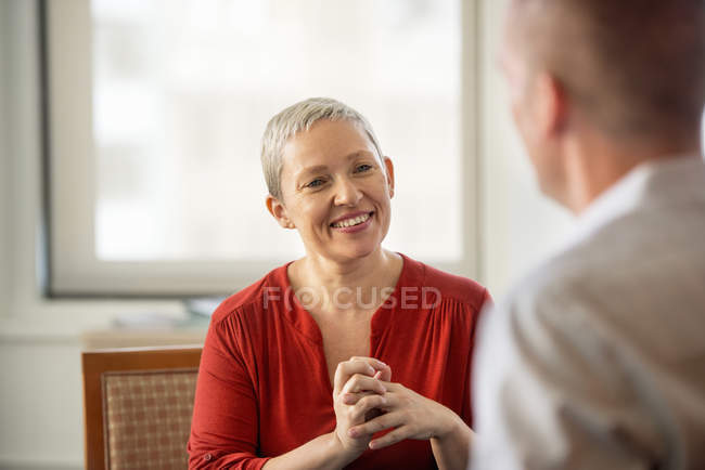Woman with her hands clasped — Stock Photo