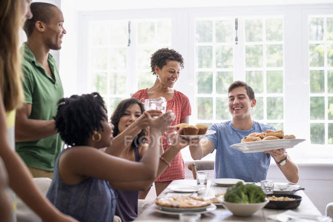 Family around a dining table — Stock Photo