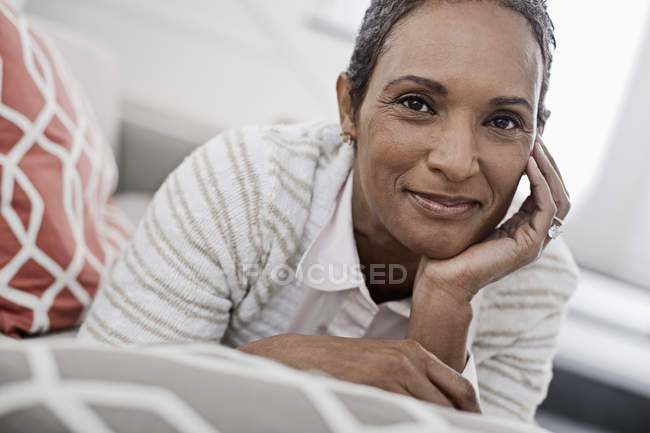 Woman at home lying on the sofa — Stock Photo