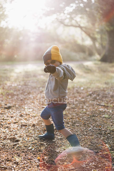 Boy striking a pose with an outstretched arm. — Stock Photo