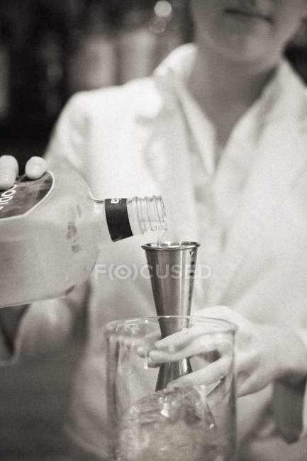 Woman mixing a cocktail — Stock Photo