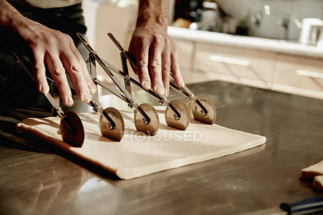 Baker working on a floured surface — Stock Photo