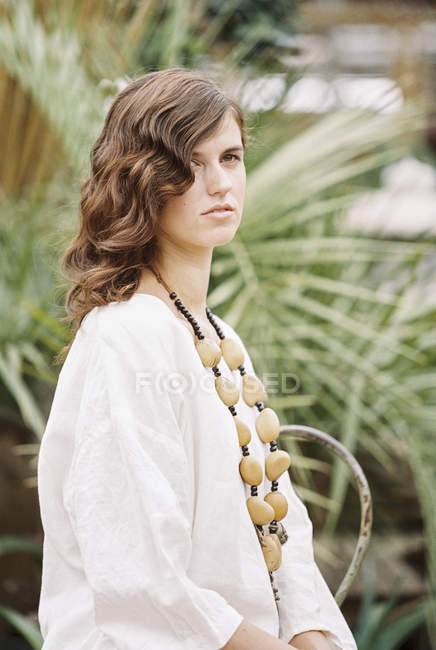 Young woman with curly brown hair — Stock Photo