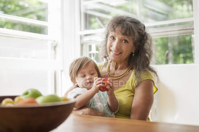 Mature woman with granddaughter — Stock Photo