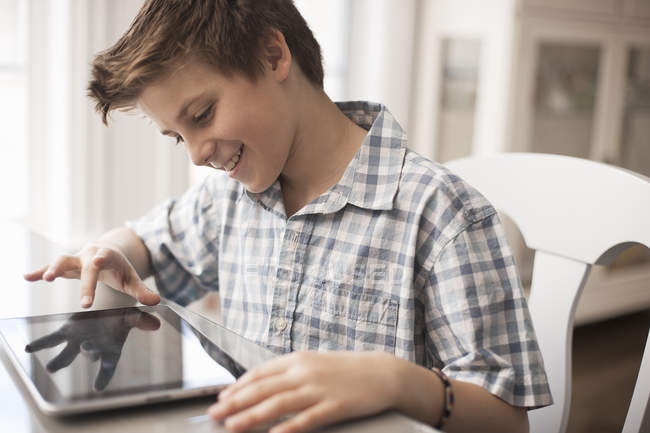 Boy using a digital tablet — Stock Photo