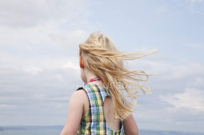 Girl with hair blowing in wind. — Colour Image, girls - Stock Photo |  #124356378