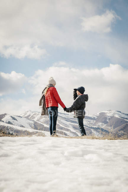 Brother and sister holding hands — Stock Photo