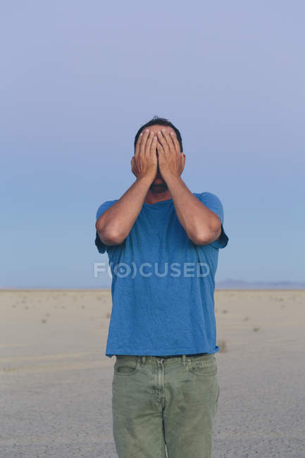 Man covering his face with his hands. — Stock Photo