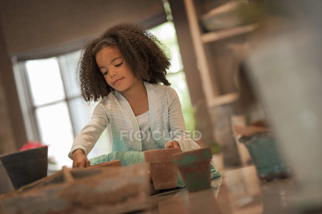 Girl planting out seeds — Stock Photo