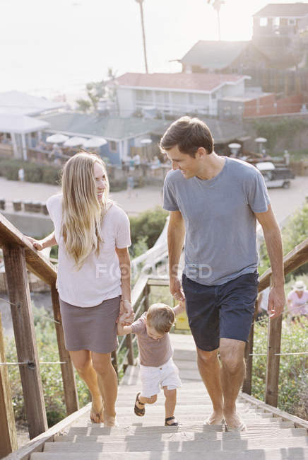 Family walking up a staircase. — Stock Photo