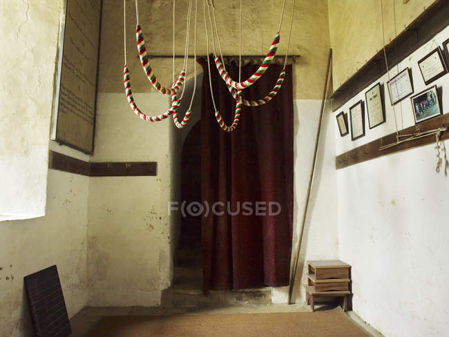 Bell ropes hanging from the roof — Stock Photo