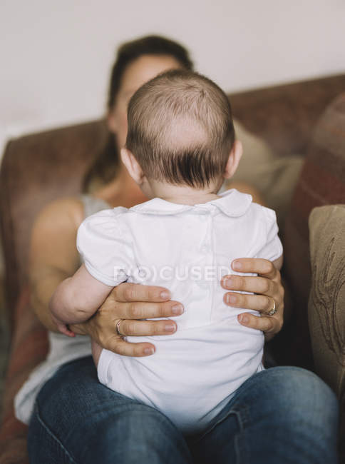 Woman holding a baby girl — Stock Photo