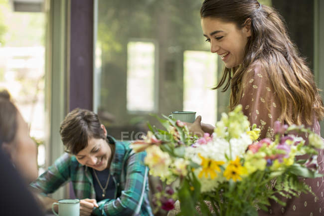 Three women talking and laughing — Stock Photo