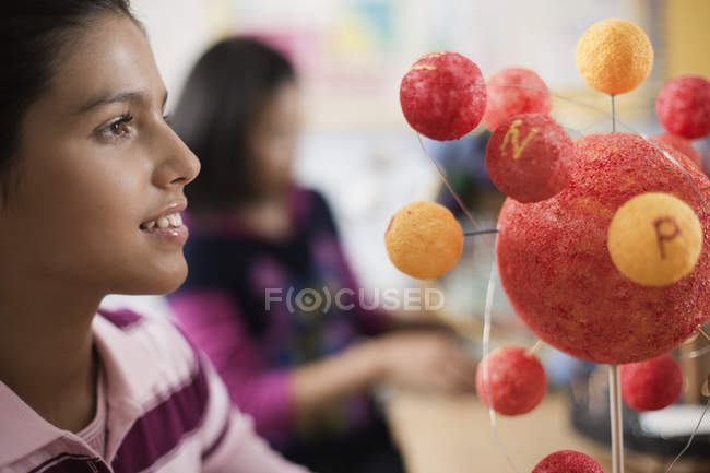 Students around a desk on a science lesson — Stock Photo