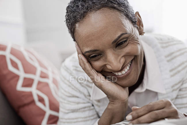 Woman at home lying on the sofa — Stock Photo
