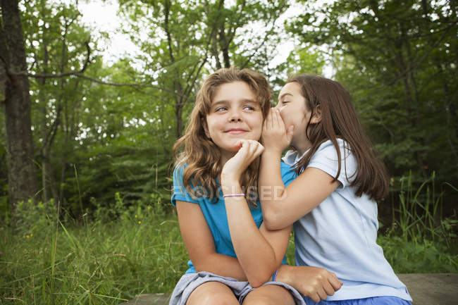 Friends sitting side by side — Stock Photo