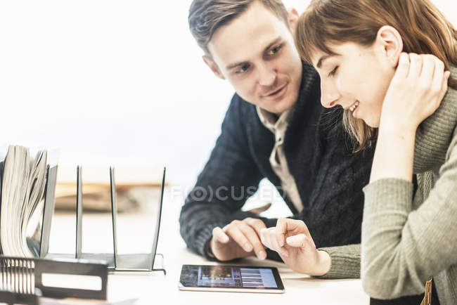 Man and a woman seated side by side — Stock Photo