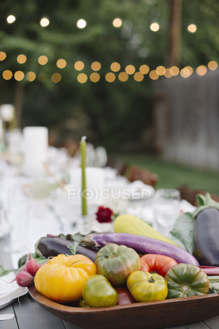 Bowl of vegetables in the foreground. — Stock Photo