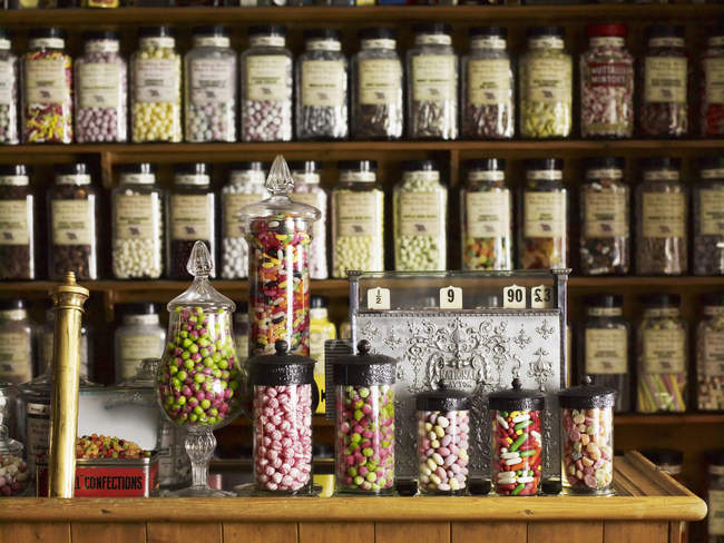 Traditional sweets in tall glass jars — Stock Photo