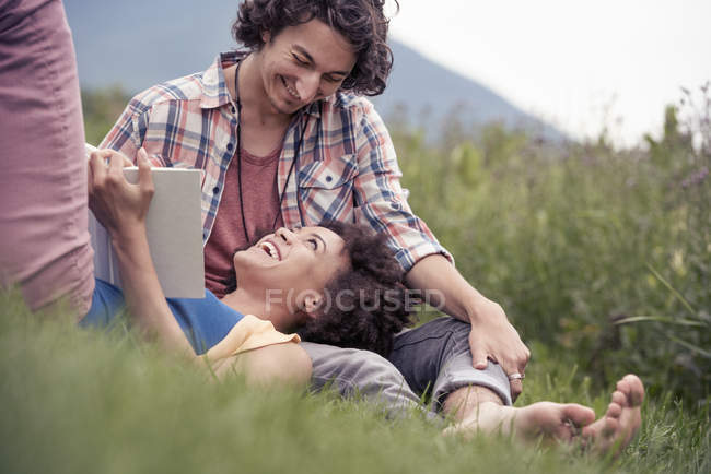 Woman looking up at a man smiling at him — Stock Photo