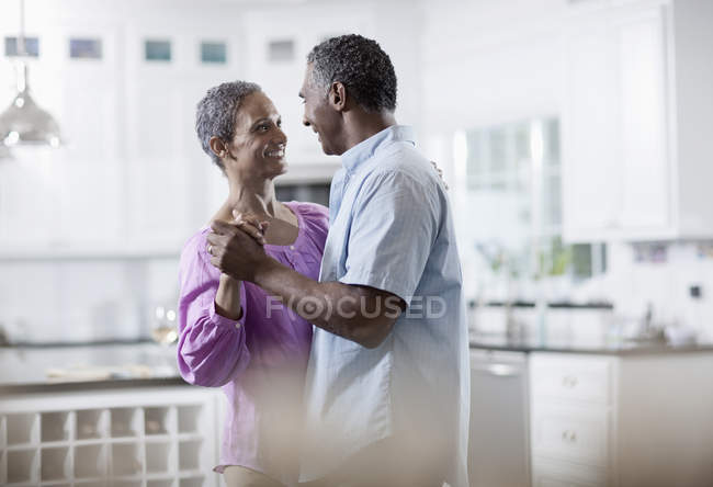 Mature African American couple dancing. — Stock Photo