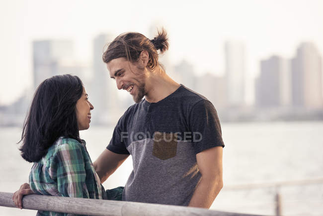 Man and woman by the waterfront — Stock Photo