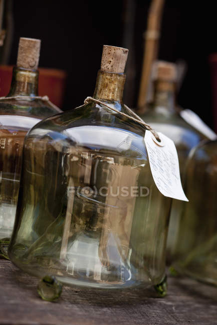 Glass containers with labels — Stock Photo
