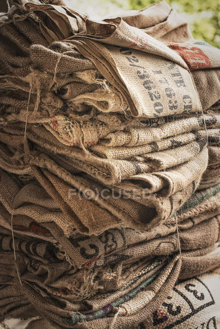 Pile of empty stamped hessian sacks — Stock Photo