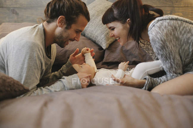 Mother, father and baby together — Stock Photo