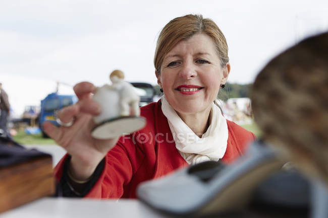 Mature woman in a red coat — Stock Photo