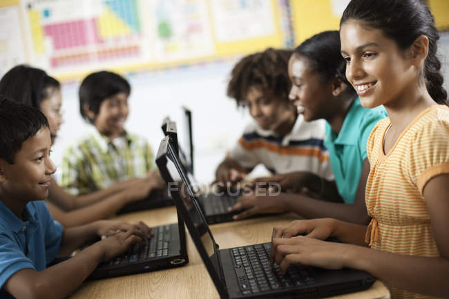 Group of students using laptops — Stock Photo