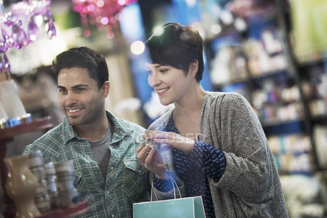 Couple in a city store, shopping. — Stock Photo
