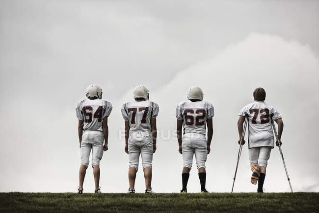 Football players in sports uniform — Stock Photo