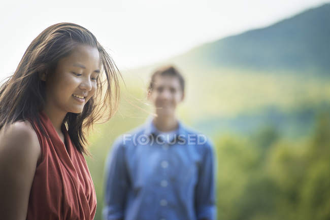 Woman and young man outdoors. — Stock Photo