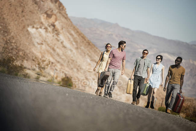 People in open desert country — Stock Photo