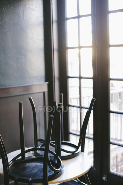 Cafe with the chairs up — Stock Photo