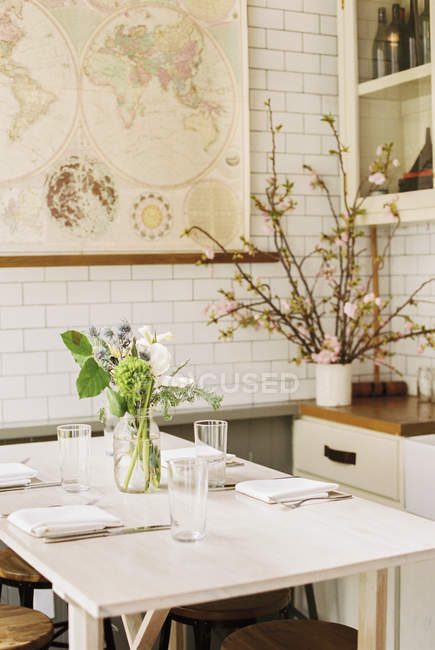 Small table with four place settings — Stock Photo