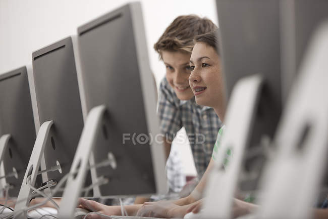 Young people looking at screen. — Stock Photo