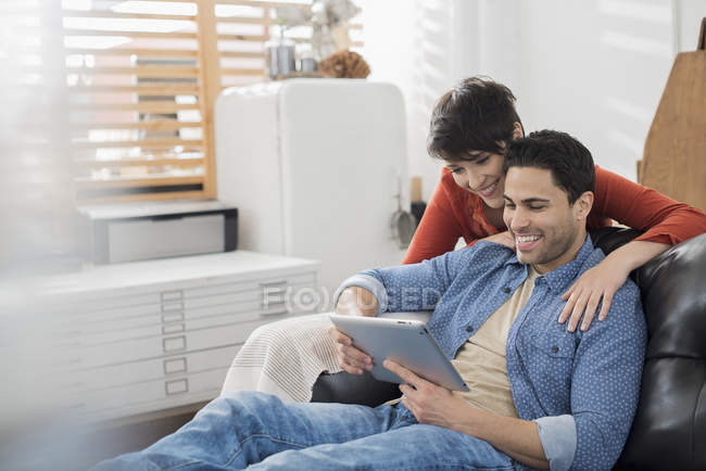 Couple using a digital tablet. — Stock Photo