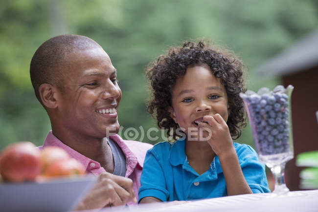 Father and son sitting together. — Stock Photo