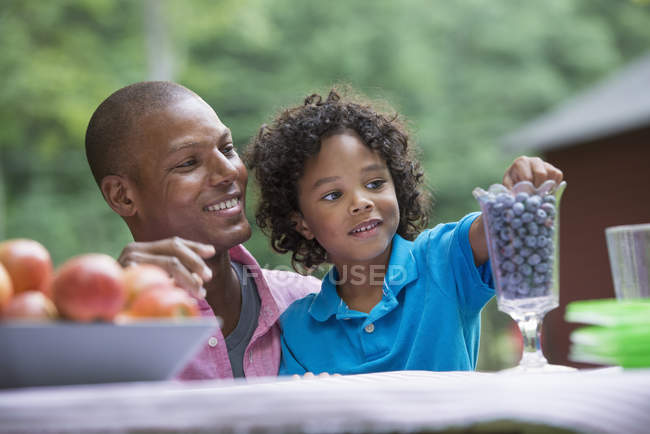 Father and son on picnic on the farm — Stock Photo